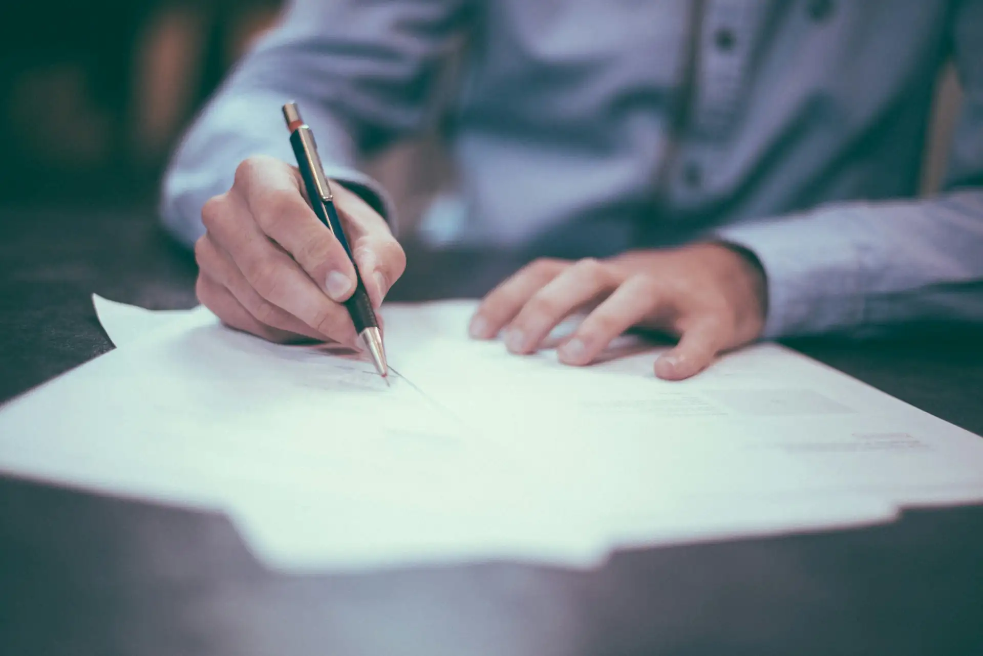 Business professional reviewing compliance documents
